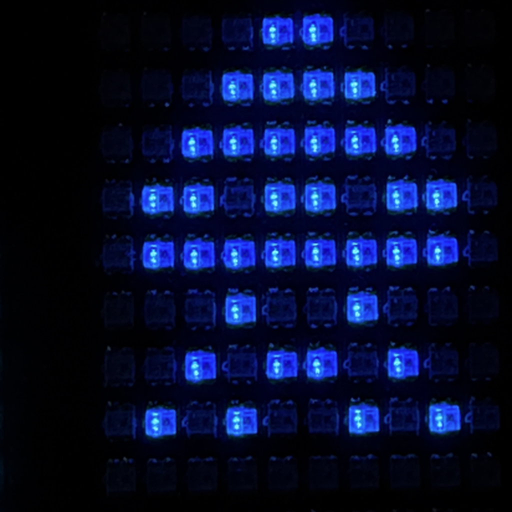 Blue Space Invader sprite on an RGB LED matrix
